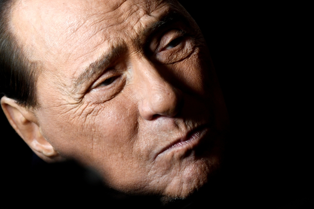 FILE PHOTO: Former Italian Prime Minister and leader of the Forza Italia (Go Italy!) party Silvio Berlusconi attends a rally ahead of a regional election in Emilia-Romagna, in Ravenna, Italy, January 24, 2020. REUTERS/Flavio Lo Scalzo