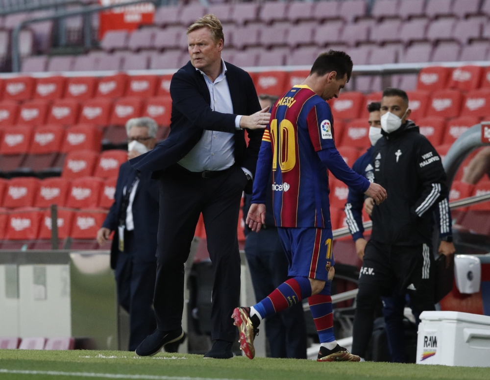 Barcelona's Lionel Messi and coach Ronald Koeman after the match REUTERS/Albert Gea