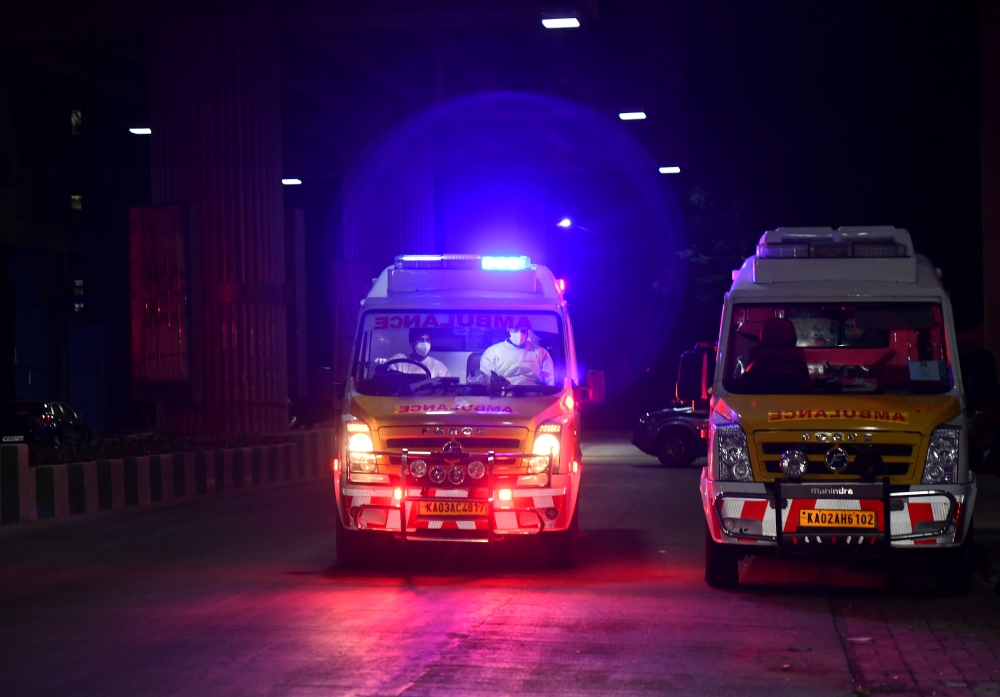Volunteers drive an ambulance amidst the coronavirus disease (COVID-19) pandemic, in Bengaluru, India, May 18, 2021. Reuters/Samuel Rajkumar