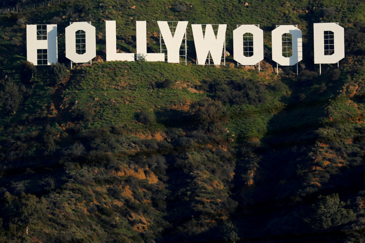 FILE PHOTO: The iconic Hollywood sign is shown on a hillside above a neighborhood in Los Angeles California, U.S., February 1, 2019. REUTERS/Mike Blake/File Photo

