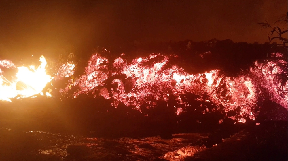 Flowing lava from the volcanic eruption of Mount Nyiragongo, which occurred late on May 22, 2021, is seen in Goma, Democratic Republic of Congo, in this still image from undated video obtained via social media. Enoch David via Reuters