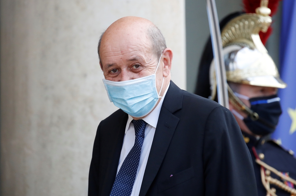 French European and Foreign Affairs Minister Jean-Yves Le Drian arrives for a dinner with French President Emmanuel Macron and leaders of African states and international organisations on the eve of a summit on aid for Africa, at Elysee Palace in Paris, F