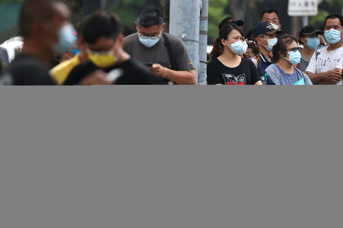 People wearing protective face masks wait to get their rapid test following a surge of coronavirus disease (COVID-19) infections in Taipei, Taiwan, May 19, 2021. REUTERS/Ann Wang

