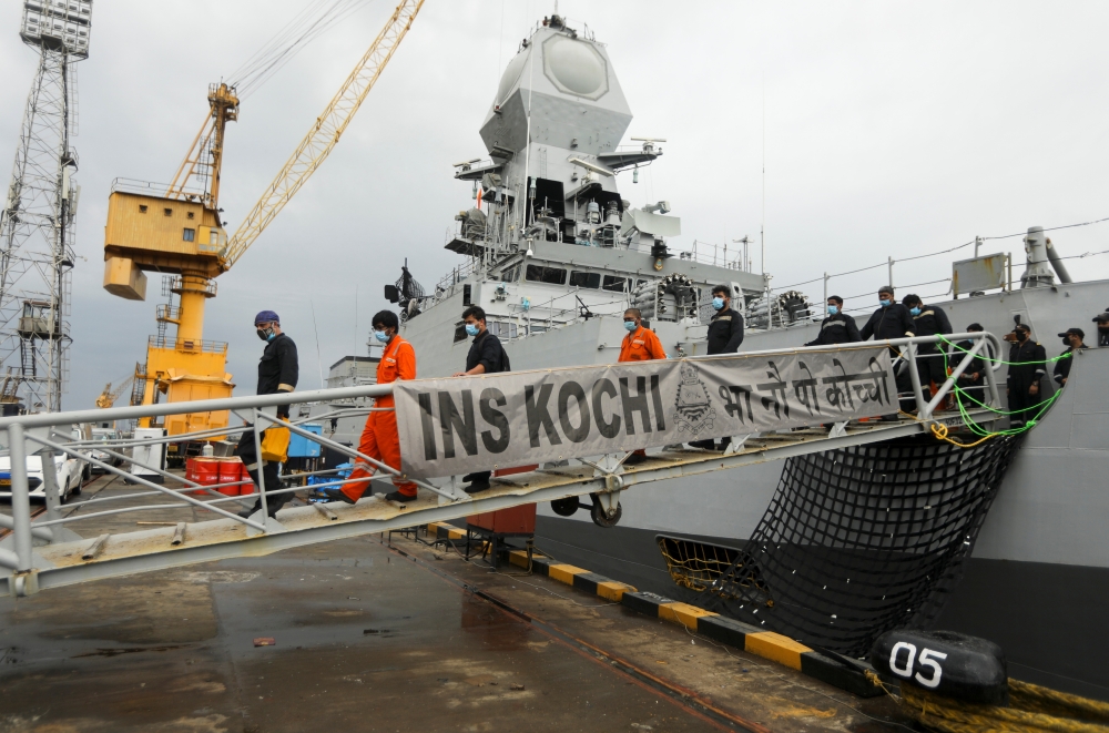 People who were stranded at sea aboard Barge P305 due to Cyclone Tauktae exit the Indian Naval Ship (INS) Kochi after they were rescued by the Indian Navy, at Naval Dockyard, Mumbai, India, May 19, 2021. REUTERS/Francis Mascarenhas