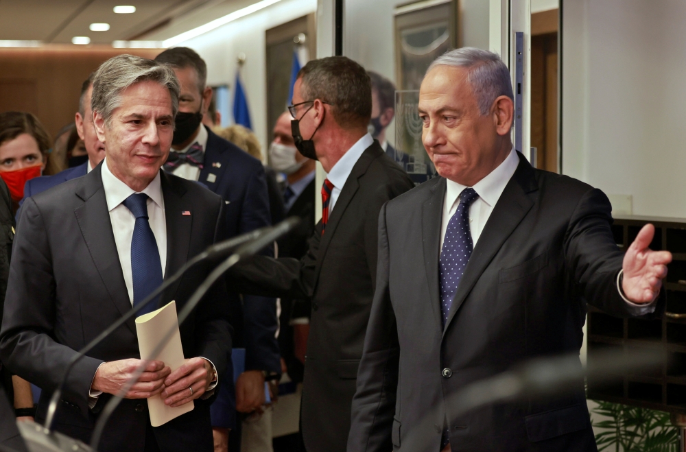 Israeli Prime Minister Benjamin Netanyahu and U.S. Secretary of State Anthony Blinken arrive for a joint news conference in Jerusalem, May 25, 2021. Menahem Kahana/Pool via REUTERS
