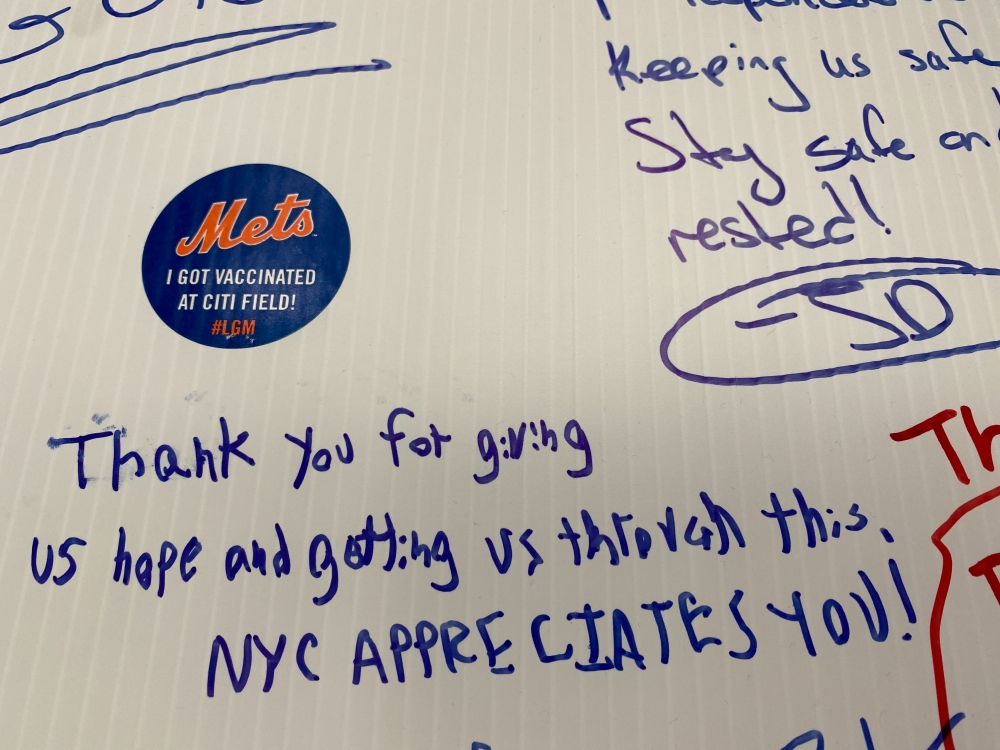 A note of gratitude is written on a wall inside a Covid-19 vaccine site attached to New York Mets stadium Citi Field in Queens, New York, U.S., May 24, 2021. Picture taken May 24, 2021. Reuters/Amy Tennery