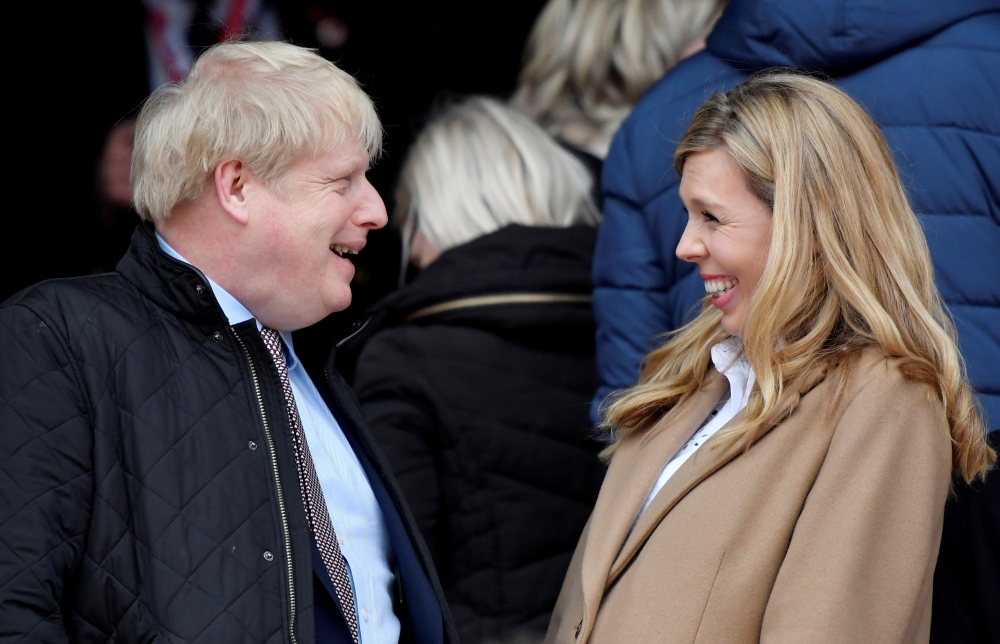 Britain's Prime Minister Boris Johnson with his partner Carrie Symonds before the match Reuters/Toby Melville/File Photo