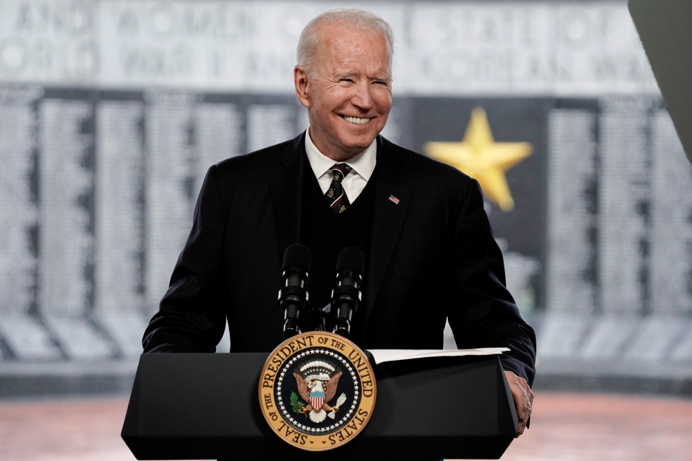 US President Joe Biden smiles as he attends an annual Memorial Day Service at Veterans Memorial Park, Delaware Memorial Bridge, New Castle, Delaware, U.S., May 30, 2021. (Reuters/Ken Cedeno)