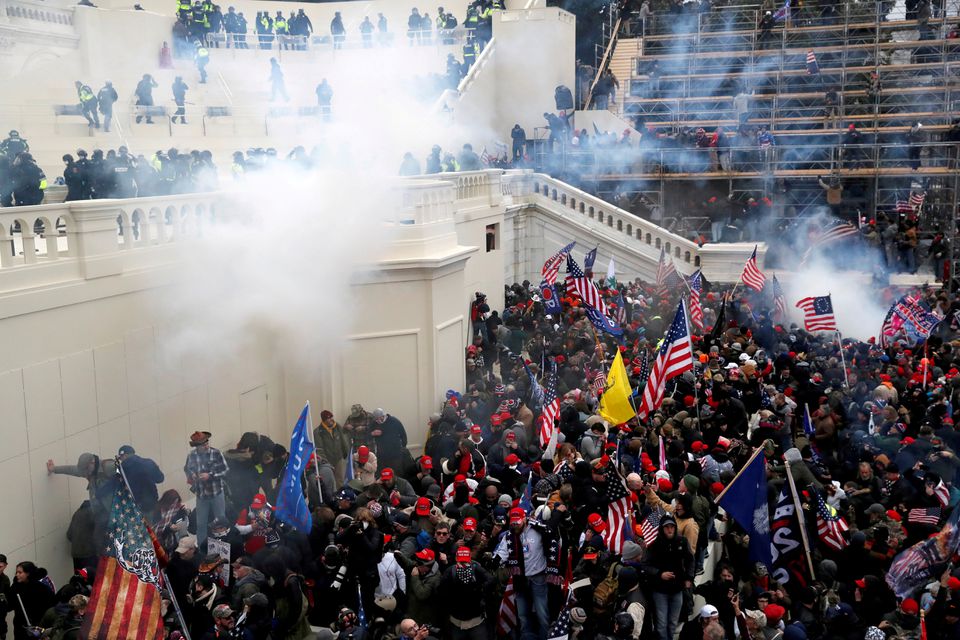 Police release tear gas into a crowd of pro-Trump protesters during clashes at a rally to contest the certification of the 2020 U.S. presidential election results by the U.S. Congress, at the U.S. Capitol Building in Washington, U.S, January 6, 2021. REUT