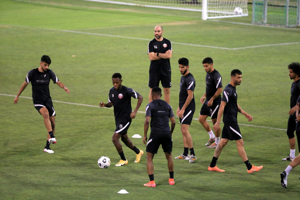 Qatari players take part in a training session, watched by coach Felix Sanchez, yesterday ahead of their Group E match against India at the Joint Asian Qualifiers for 2022 FIFA World Cup and 2023 AFC Asian Cup. Pic: Hussein Sayed