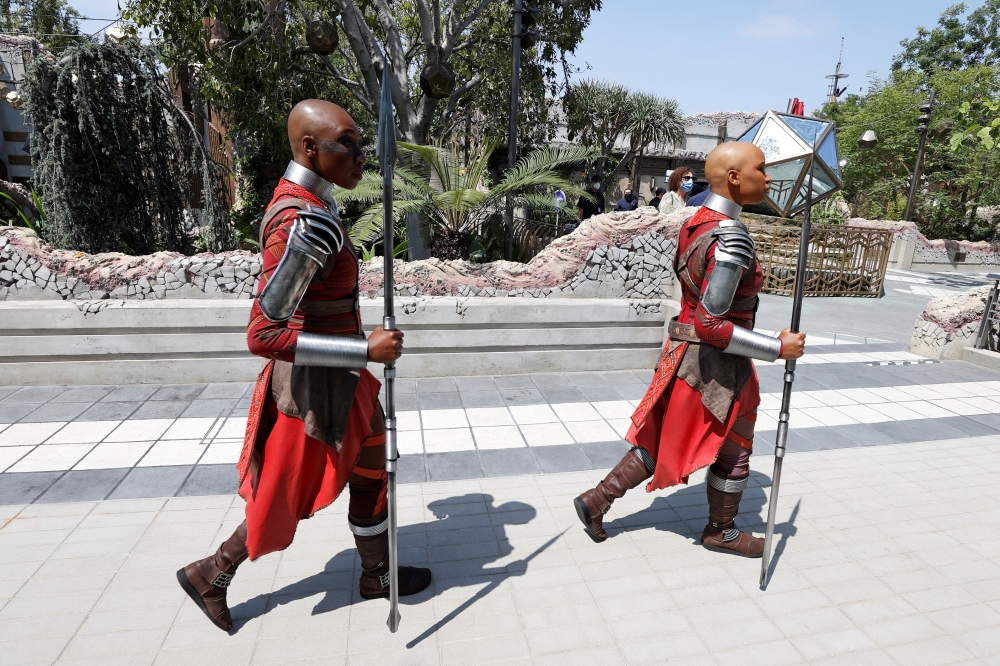 Dora Milaje characters walk ahead of the opening of the Avengers Campus area at Disney California Adventure Park in Anaheim, California, U.S., June 1, 2021. Picture taken June 1, 2021. REUTERS/Mario Anzuoni