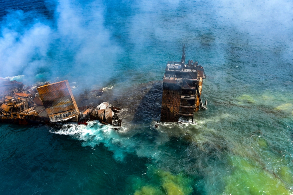Smoke rises from a fire onboard the MV X-Press Pearl vessel as it sinks while being towed into deep sea off the Colombo Harbour, in Sri Lanka June 2, 2021. Sri Lanka Airforce Media/Handout via REUTERS 