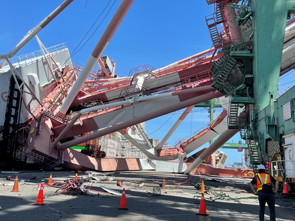 View of the damage after a crane collapsed from a collision with a ship at the port of Kaohsiung, Taiwan June 3, 2021 in this handout image. Taiwan International Ports Corp/Handout via Reuters