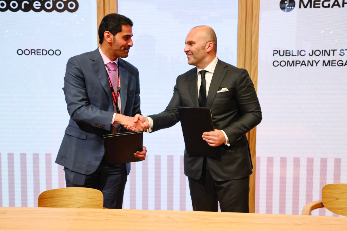 Ooredoo CEO Sheikh Mohammed bin Abdulla Al Thani and MegaFon CEO Gevork Vermishyan during agreement signing ceremony.