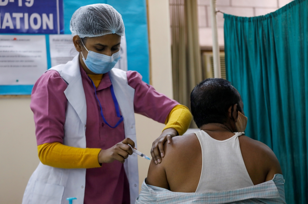 File photo: A man receives a Bharat Biotech's COVID-19 vaccine called COVAXIN, at a vaccination centre, in New Delhi, India, February 13, 2021. Reuters/Adnan Abidi/File Photo/File Photo