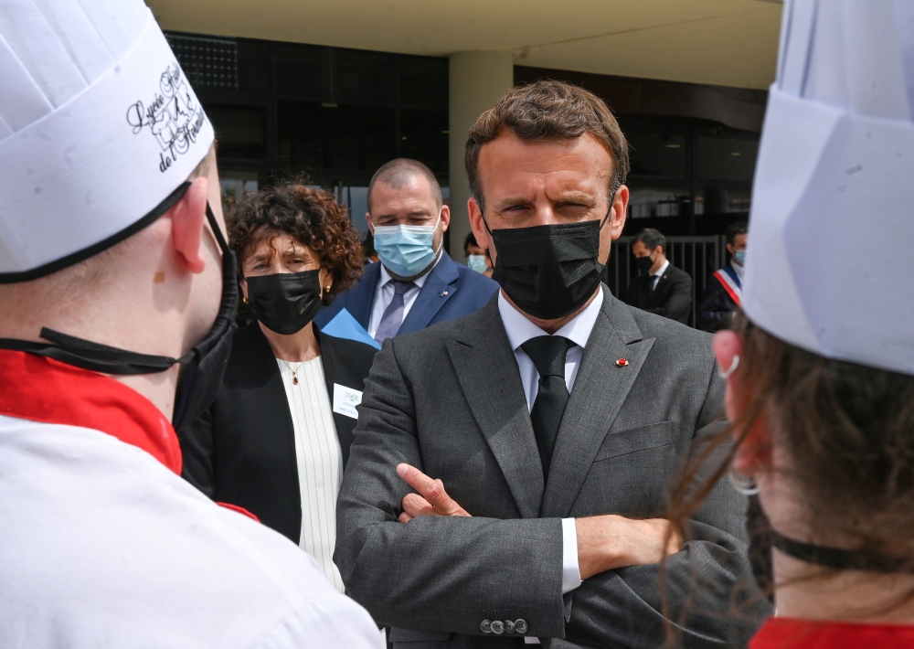 French President Emmanuel Macron talks with hospitality school students in Tain l'Hermitage, Drome department, France June 8, 2021. Philippe Desmazes/REUTERS