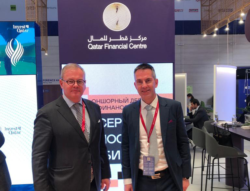 Henk J Hoogendoorn, Managing Director of Financial Sector Office, QFC, with an official during SPIEF.