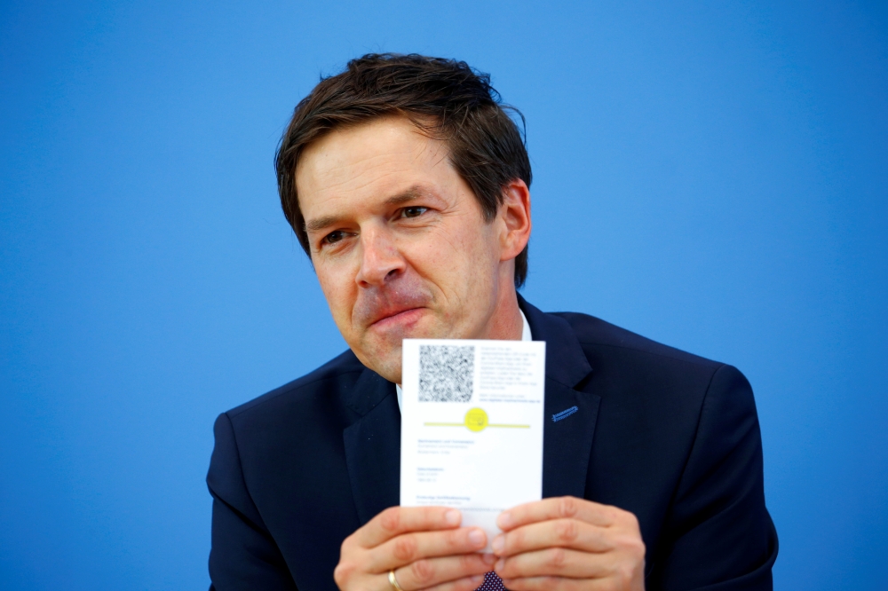 Ronald Fritz, CovPass project manager at IBM, attends a news conference on the current coronavirus disease (COVID-19) situation, in Berlin, Germany June 10, 2021. REUTERS/Michele Tantussi/Pool