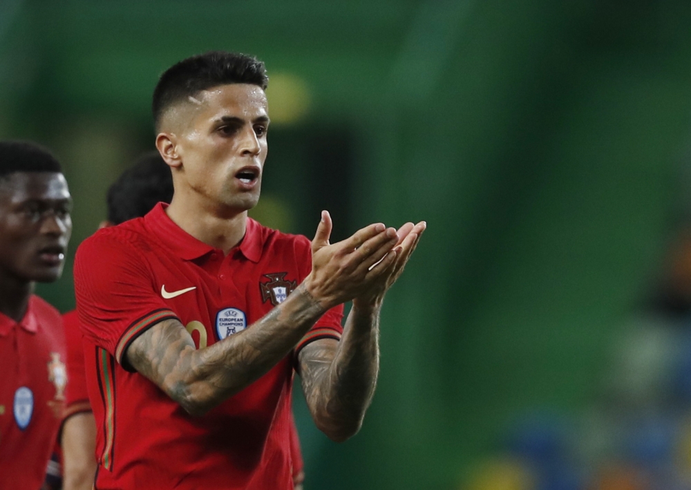 Portugal's Joao Cancelo celebrates scoring their third goal REUTERS/Pedro Nunes