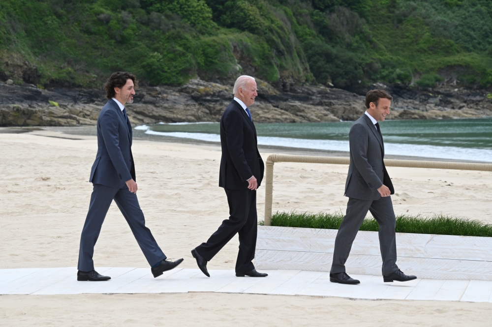 Canada's Prime Minister Justin Trudeau, US President Joe Biden and France's President Emmanuel Macron arrive for the G7 meeting in Carbis Bay, Cornwall, Britain, June 11, 2021. Leon Neal/Pool via Reuters