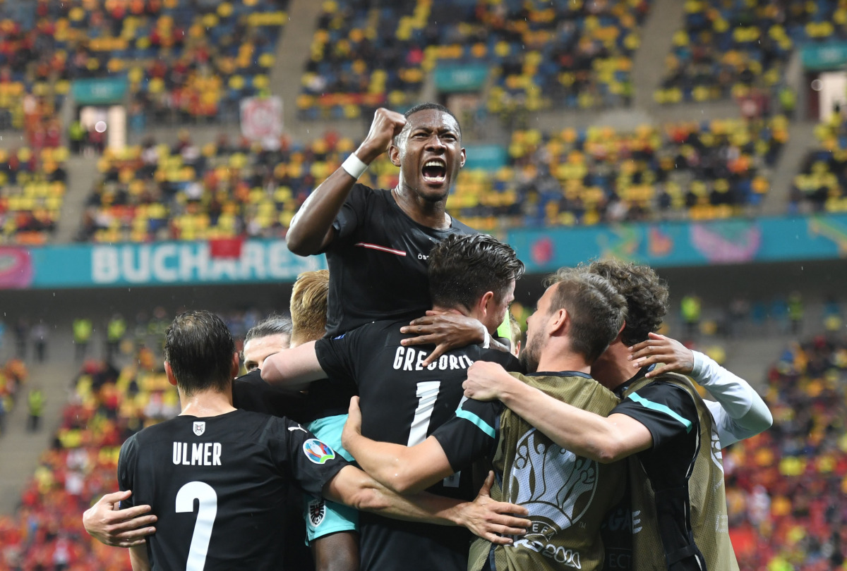 Soccer Football - Euro 2020 - Group C - Austria v North Macedonia - National Arena, Bucharest, Romania - June 13, 2021 Austria's Michael Gregoritsch celebrates scoring their second goal with David Alaba and teammates Pool via REUTERS/Daniel Mihailescu
