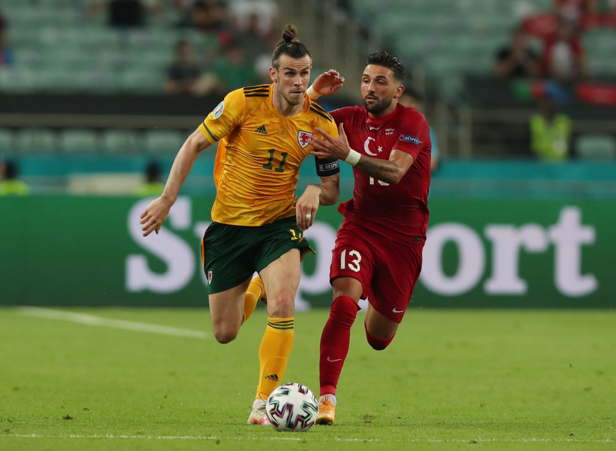 Soccer Football - Euro 2020 - Group A - Turkey v Wales - Baku Olympic Stadium, Baku, Azerbaijan - June 16, 2021 Wales' Gareth Bale in action with Turkey's Umut Meras Pool via REUTERS/Tolga Bozoglu
