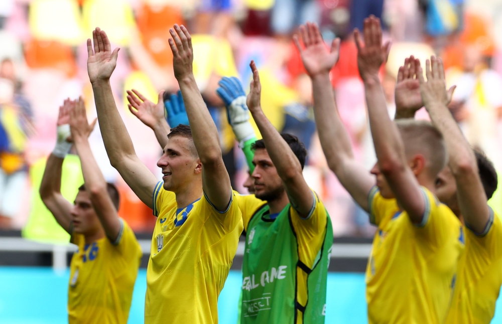Ukraine players celebrate after the match Pool via REUTERS/Marko Djurica