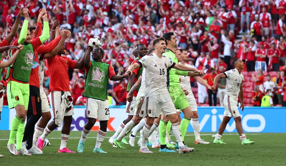 Soccer Football - Euro 2020 - Group B - Denmark v Belgium - Parken Stadium, Copenhagen, Denmark - June 17, 2021 Belgium players celebrate after the match Pool via REUTERS/Wolfgang Rattay
