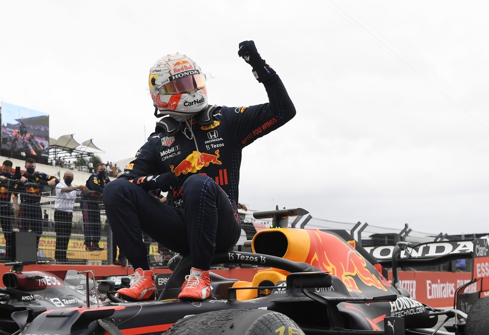 Red Bull's Max Verstappen celebrates after winning the race Pool via REUTERS/Nicolas Tucat