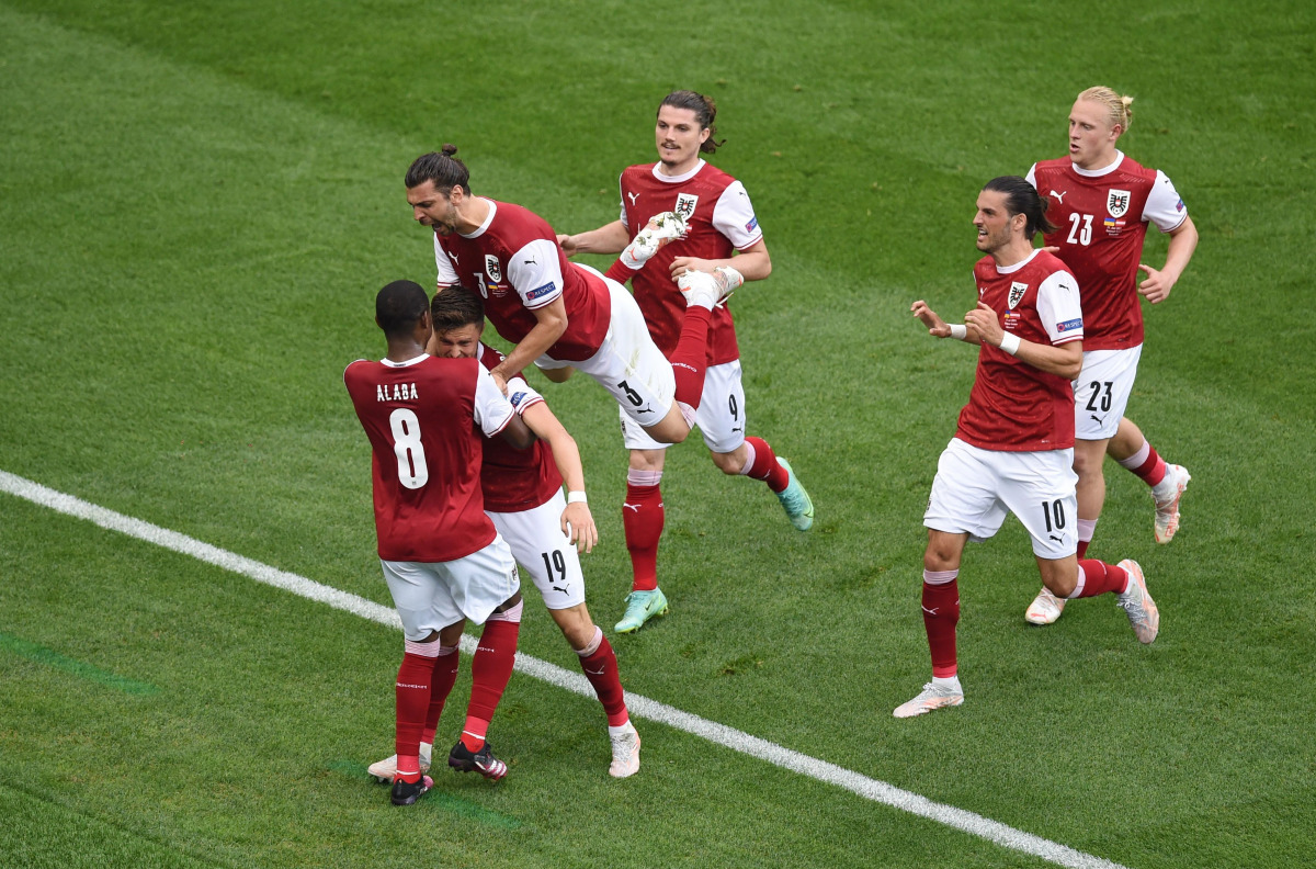 Soccer Football - Euro 2020 - Group C - Ukraine v Austria - National Arena Bucharest, Bucharest, Romania - June 21, 2021 Austria's Christoph Baumgartner celebrates scoring their first goal with teammates Pool via REUTERS/Mihai Barbu
