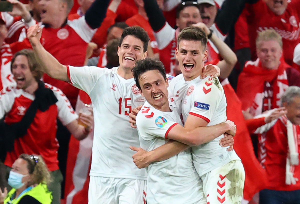 Soccer Football - Euro 2020 - Group B - Russia v Denmark - Parken Stadium, Copenhagen, Denmark - June 21, 2021 Denmark's Joakim Maehle celebrates scoring their fourth goal with Thomas Delaney and Christian Norgaard Pool via REUTERS/Wolfgang Rattay
