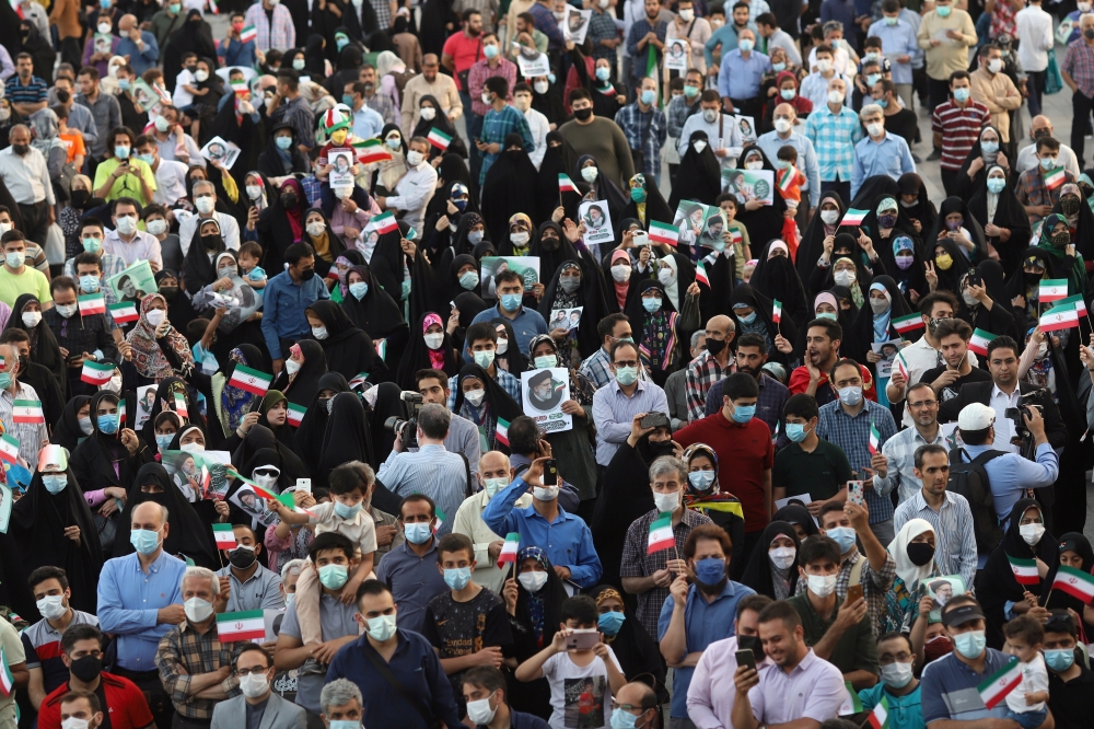 Supporters of Ebrahim Raisi gather to celebrate his presidential election victory in Tehran, Iran June 19, 2021. Majid Asgaripour/WANA (West Asia News Agency) via Reuters