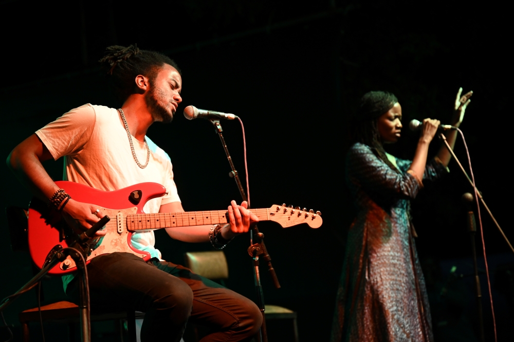 Guitarist Brahim Wone and singer Awa Ly perform on stage at the Saint Louis Jazz Festival in Saint Louis, Senegal, June 18, 2021. Picture taken June 18, 2021. REUTERS/Cooper Inveen.