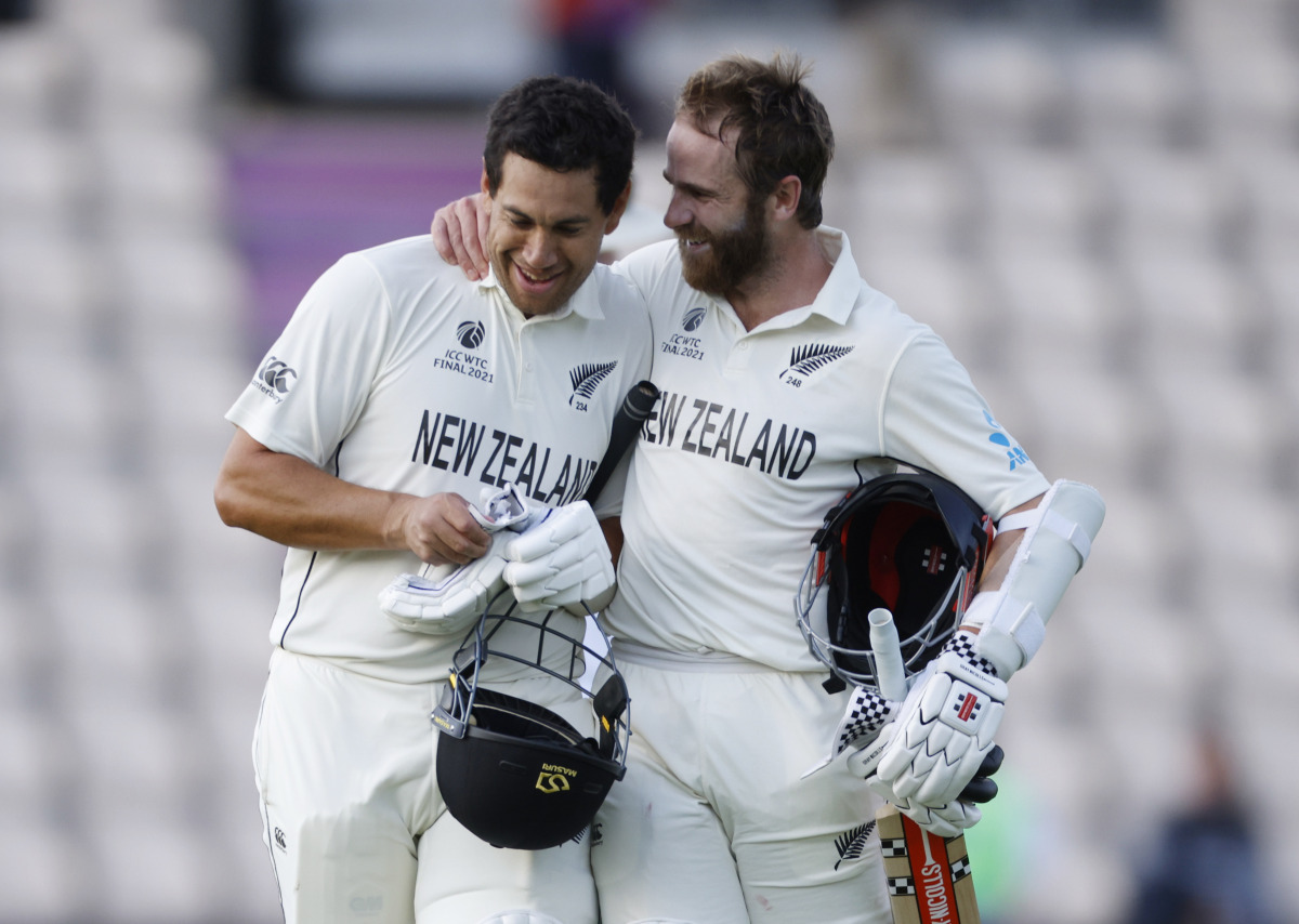 Cricket - ICC World Test Championship Final - India v New Zealand - Rose Bowl, Southampton, Britain - June 23, 2021 New Zealand's Kane Williamson and Ross Taylor celebrate after winning the ICC World Test Championship Final Action Images via Reuters/John 