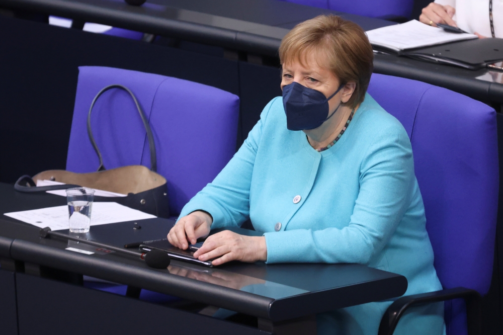 German Chancellor Angela Merkel sits after she delivered a government declaration on the upcoming European Council meeting at the lower house of parliament Bundestag in Berlin, Germany, June 24, 2021. (Reuters/Christian Mang)