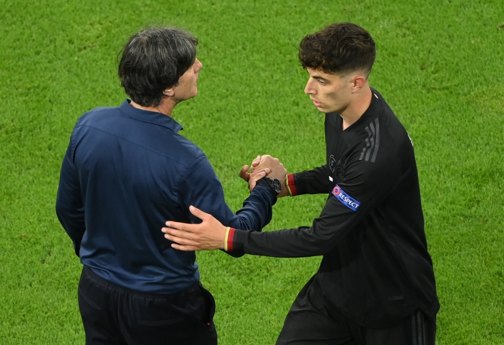 Germany coach Joachim Loew with Kai Havertz after he is substituted Pool via REUTERS/Matthias Hangst