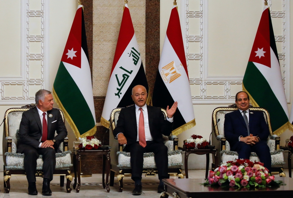 Iraqi President Barham Salih meets with King Abdullah II of Jordan and Egypt's President Abdel Fattah al-Sisi, in Baghdad, Iraq, June 27, 2021. REUTERS/Khalid al-Mousily