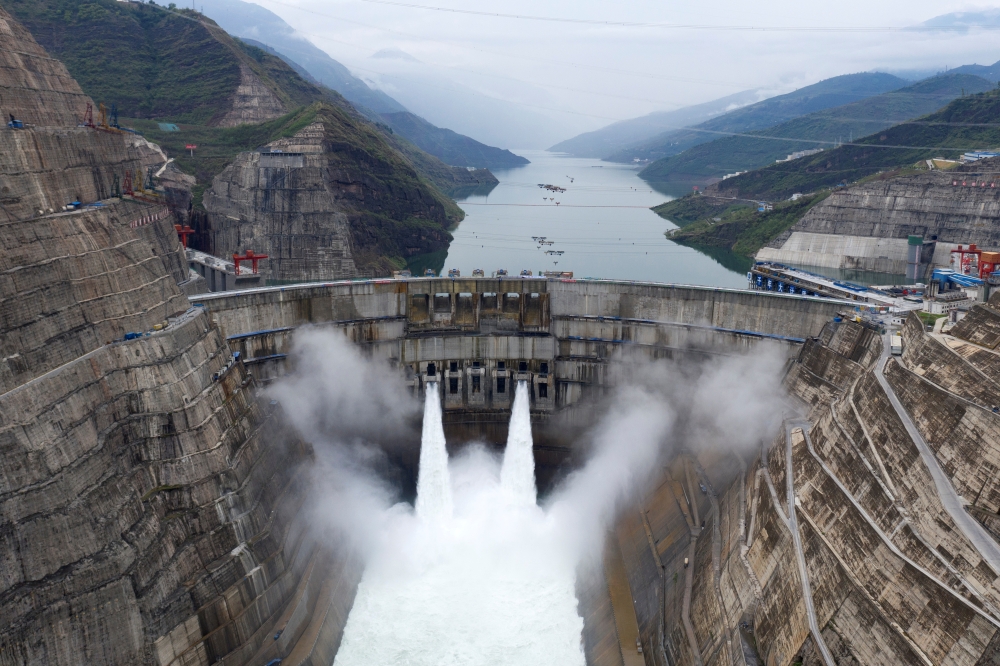 The Baihetan hydropower plant is seen in operation on the border between Qiaojia county of Yunnan province and Ningnan county of Sichuan province, China June 28, 2021. Picture taken with a drone. cnsphoto via REUTERS