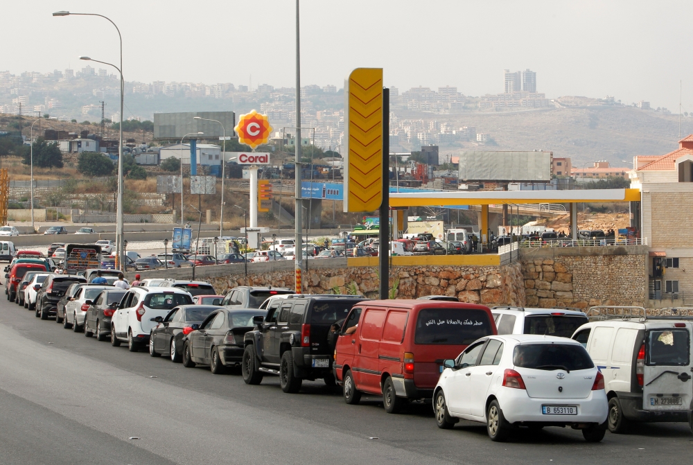 FILE PHOTO: Cars stand in line at a gas station as they wait to fuel up in Damour, Lebanon June 25, 2021. REUTERS/Aziz Taher