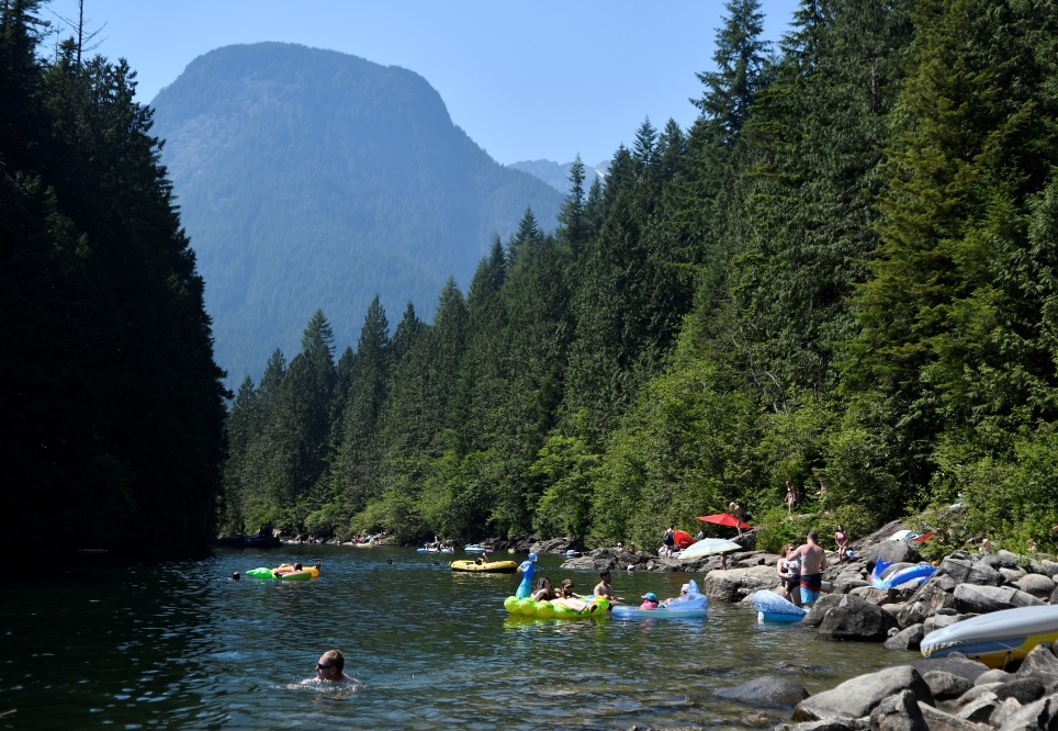 People cool off in Alouette Lake during the scorching weather of a heatwave in Maple Ridge, British Columbia, Canada June 28, 2021. REUTERS/Jennifer Gauthier
