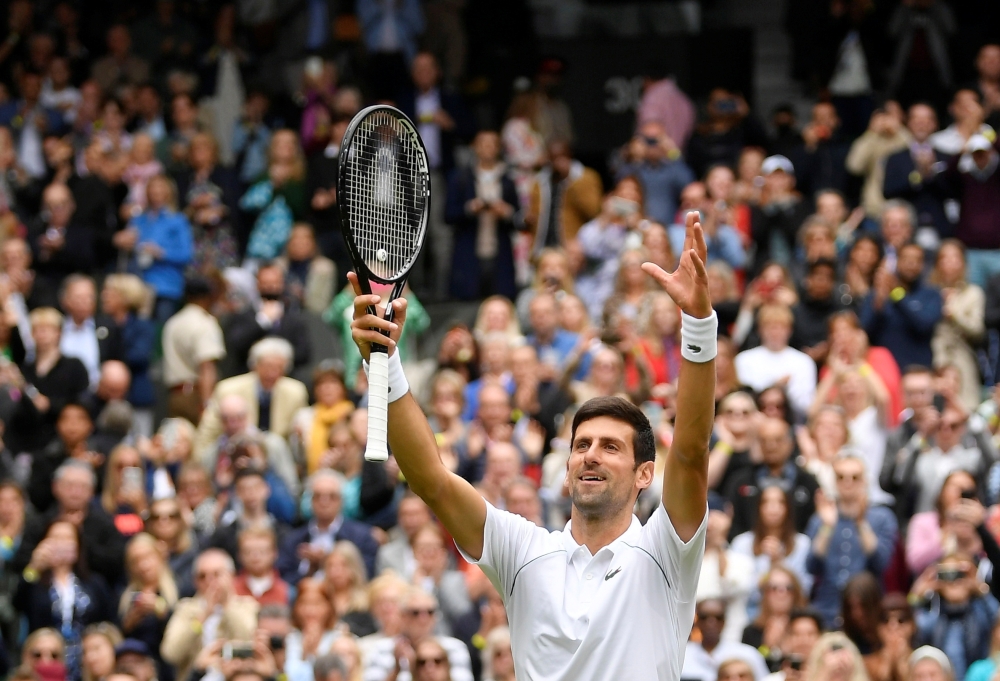 Serbia'a Novak Djokovic celebrate winning his first round match against South Africa's Kevin Anderson REUTERS/Toby Melville