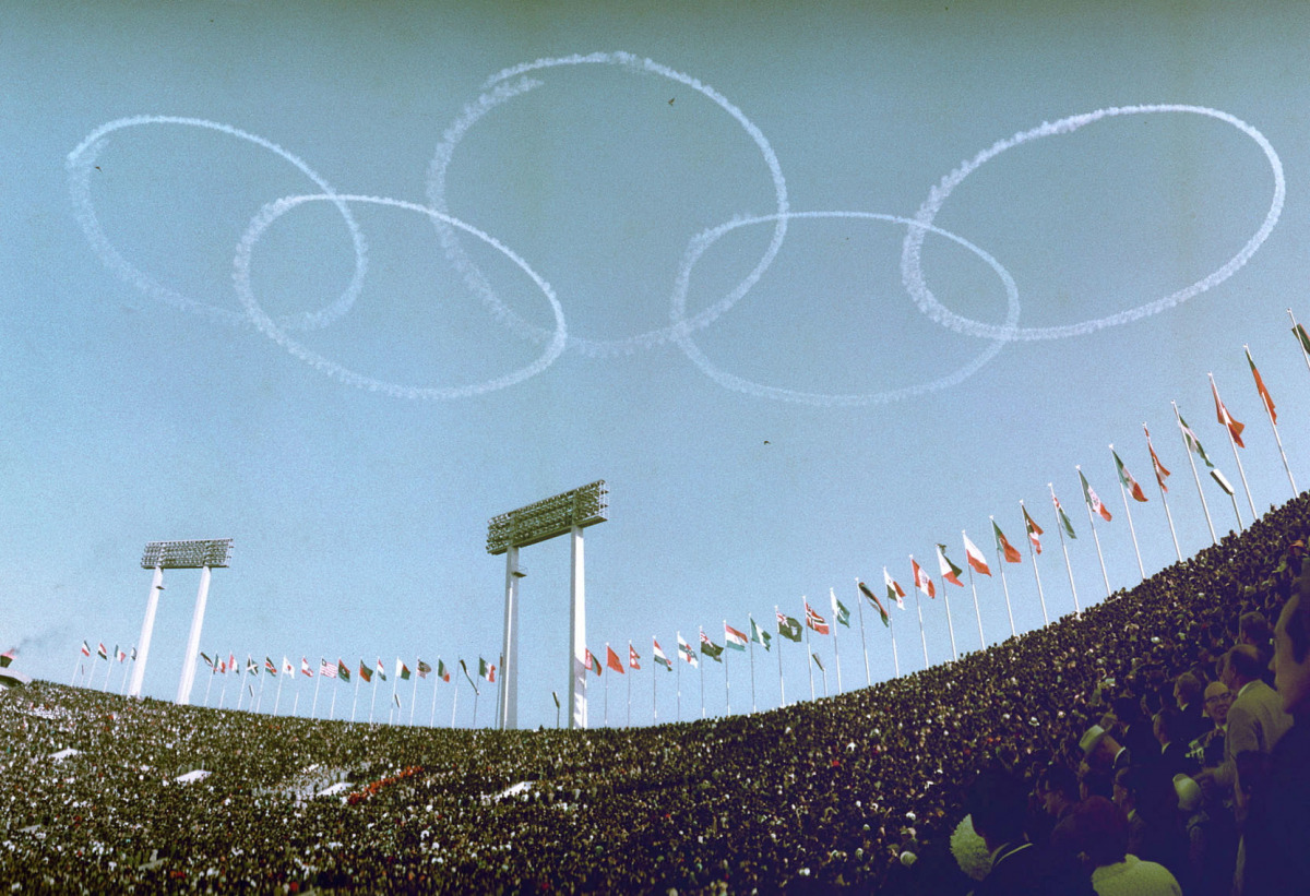 Japanese air force's aerobatic team Blue Impulse draws Olympic rings in the sky at the opening ceremony of the 1964 Tokyo Olympic Games, over the captial in Japan in this photo taken by Kyodo October 10, 1964. Picture taken October 10, 1964. Kyodo via REU