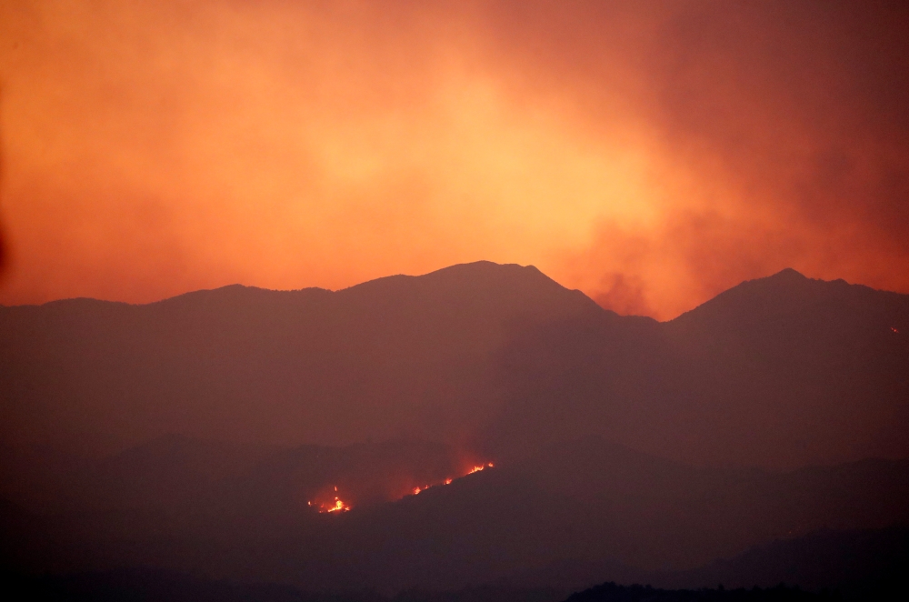 Wildfire rages in the Larnaca mountain region, Cyprus July 3, 2021. Picture taken July 3, 2021. REUTERS/George Christophorou