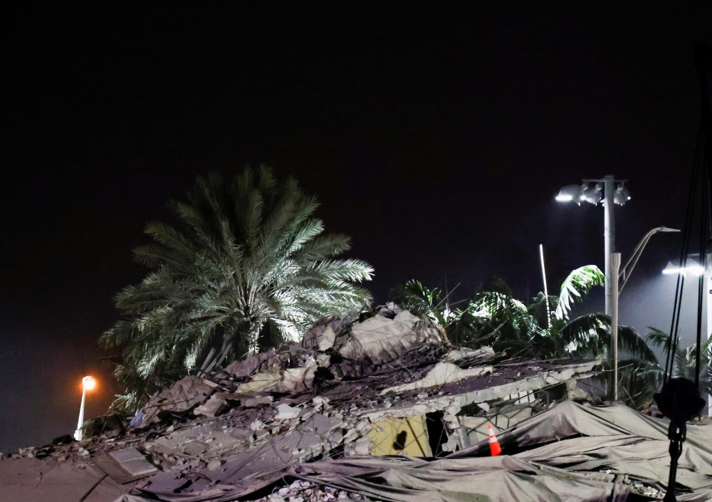 Debris seen at the site after the partially collapsed Champlain Towers South residential building is demolished, in Surfside, Florida, U.S., July 4, 2021. REUTERS/Marco Bello