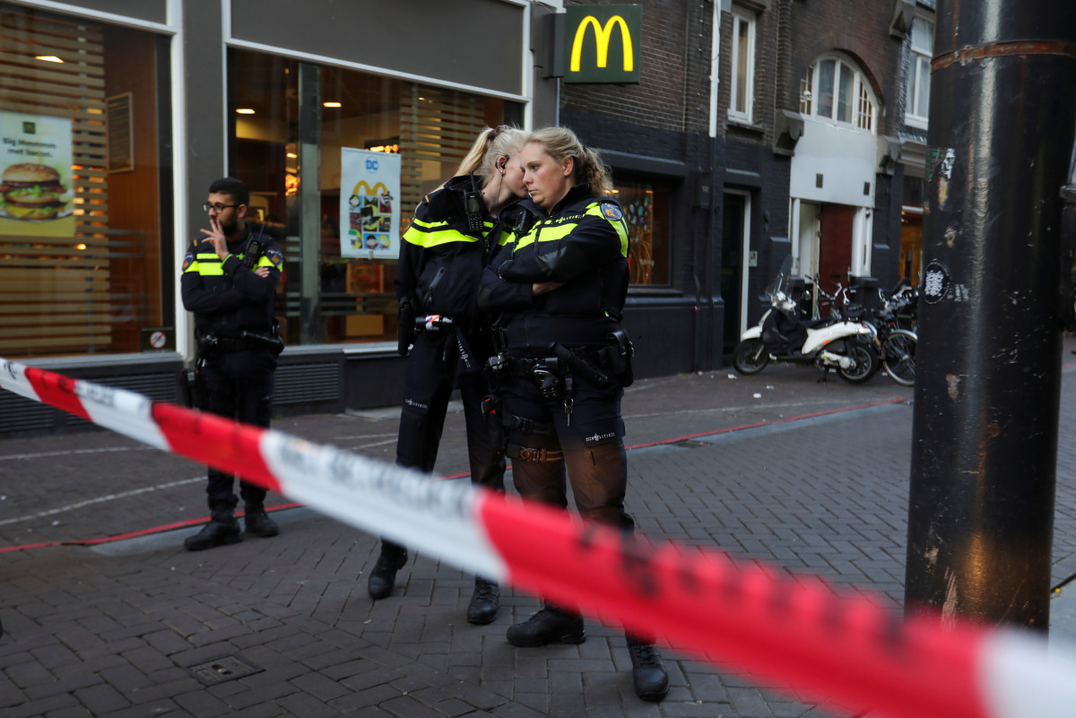Police officers stand guard to secure the area where Dutch celebrity crime reporter Peter R. de Vries, known for his reporting on some of the most renowned criminals in the Netherlands, was reportedly shot and seriously injured, in Amsterdam, Netherlands,