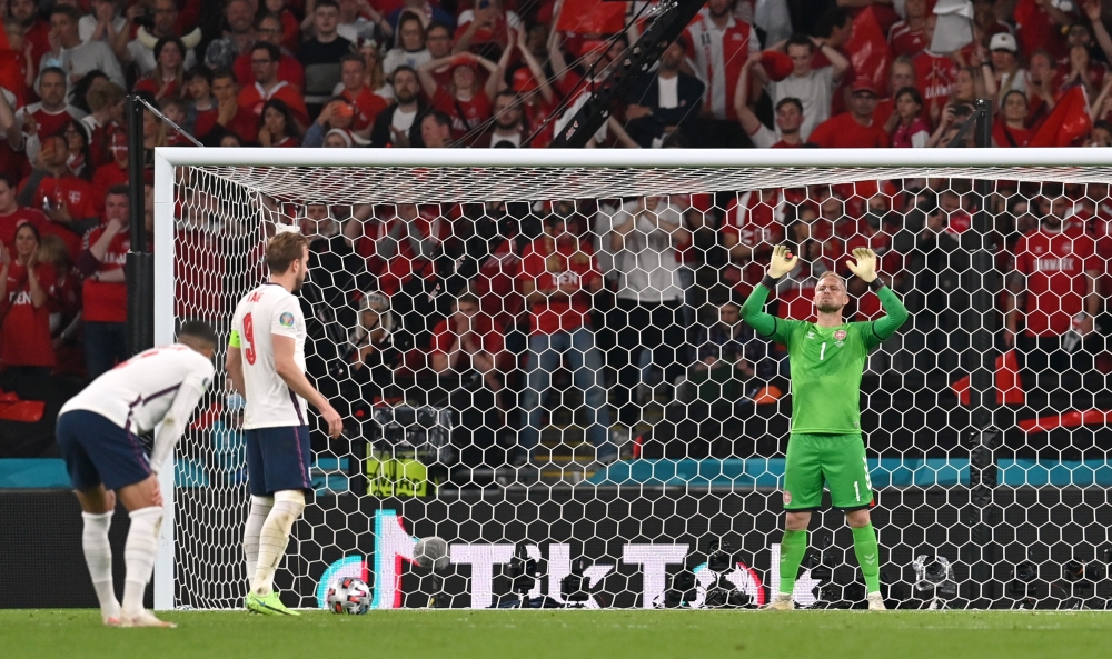 England's Harry Kane prepares to take a penalty before Denmark's Kasper Schmeichel saves and Kane scores their second goal from the rebound Pool via REUTERS/Paul Ellis
