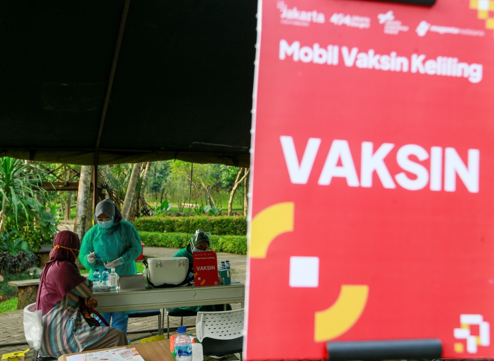 A healthcare worker prepares a dose of a vaccine against the coronavirus disease (COVID-19), as the Indonesia government speeds up its inoculation effort by deploying a mobile vaccine van, in Jakarta, Indonesia, July 8, 2021. Picture taken July 8, 2021. R