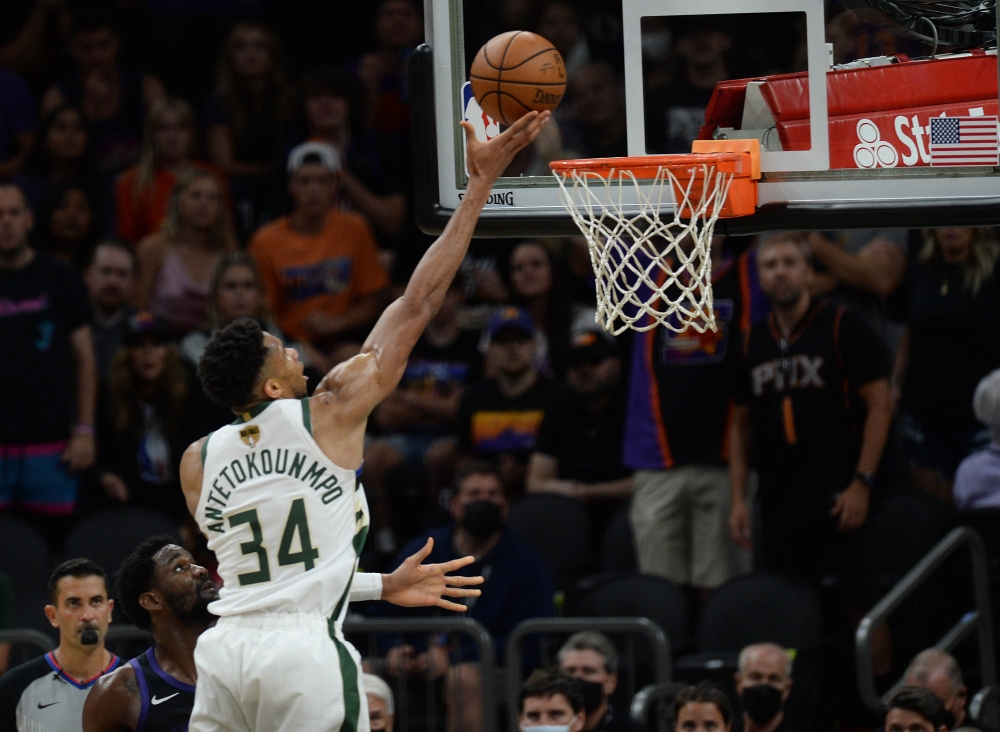 Milwaukee Bucks forward Giannis Antetokounmpo (34) shoots for a basket against the Phoenix Suns during the second half in game two of the 2021 NBA Finals at Phoenix Suns Arena. Mandatory Credit: Joe Camporeale