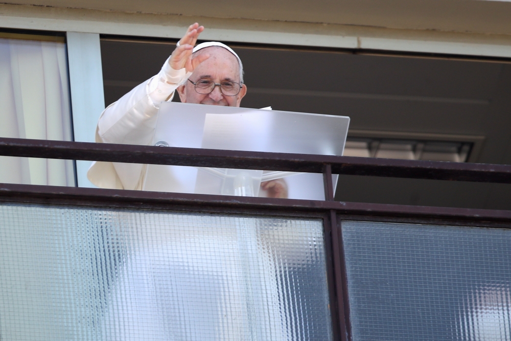 Pope Francis leads the Angelus prayer from a balcony of the Gemelli hospital, as he recovers following scheduled surgery on his colon, in Rome, Italy, July 11, 2021. REUTERS/Yara Nardi