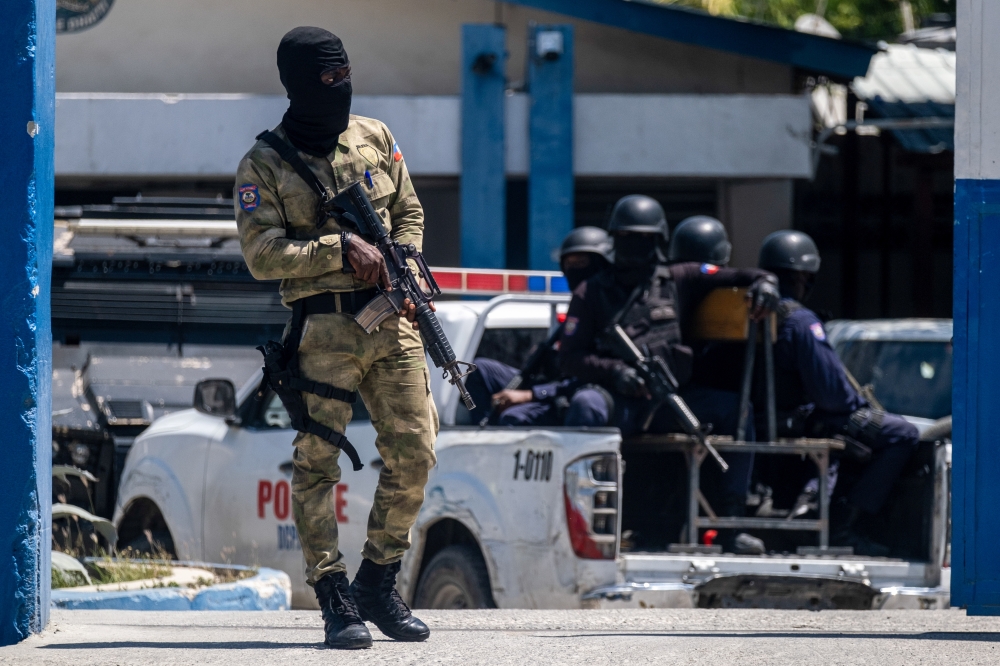 An armed Haitian Army troop guards the entrance of the General Directorate of the police where the suspects of the assassination of Haiti's President Jovenel Moise are detained, in Port-au-Prince, Haiti July 10, 2021. REUTERS/Ricardo Arduengo